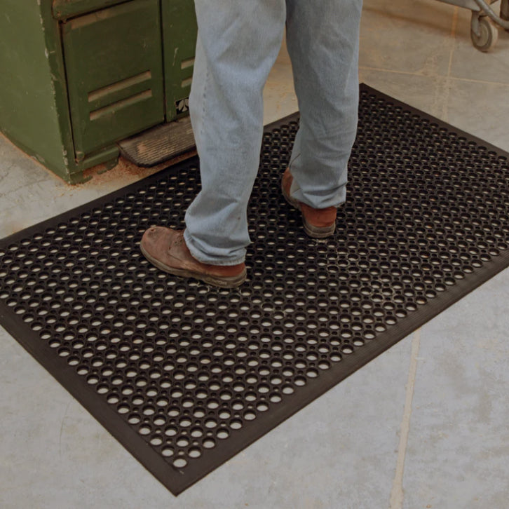 man on an anti-fatigue mat