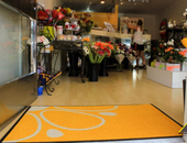 LOGO MAT FOR A LOCAL FLORIST